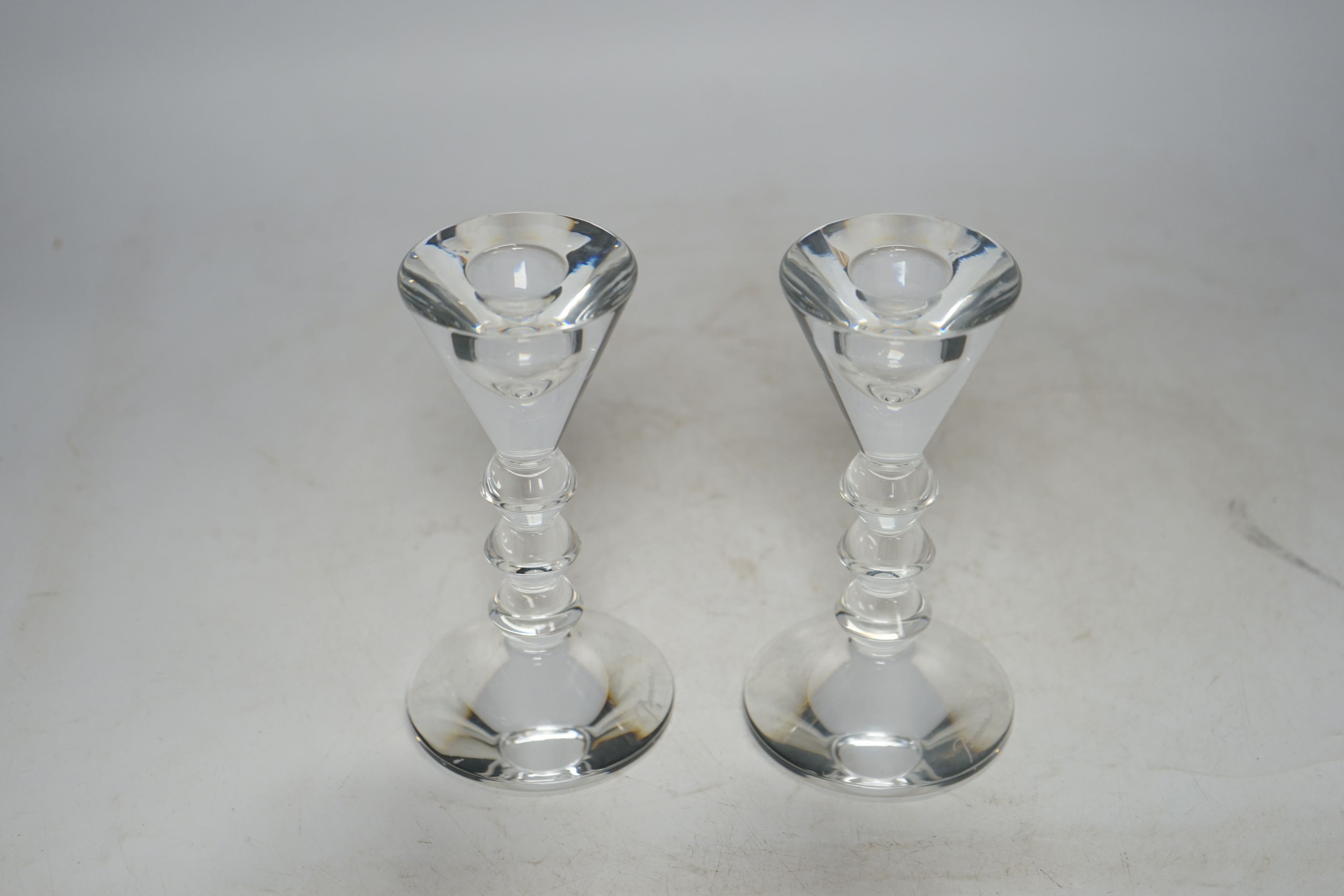 Two boxed Baccarat glass candlesticks, 13cm high. Condition - good